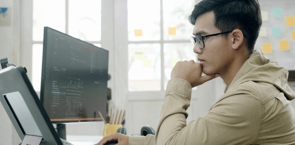 Website Services Image man sitting at a computer